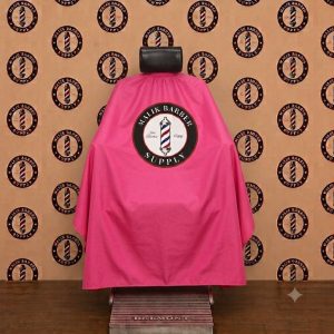 Professional barber cape with a custom logo printing area displayed on a barber chair.