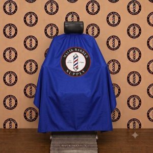 Professional barber cape with a custom logo printing area displayed on a barber chair.