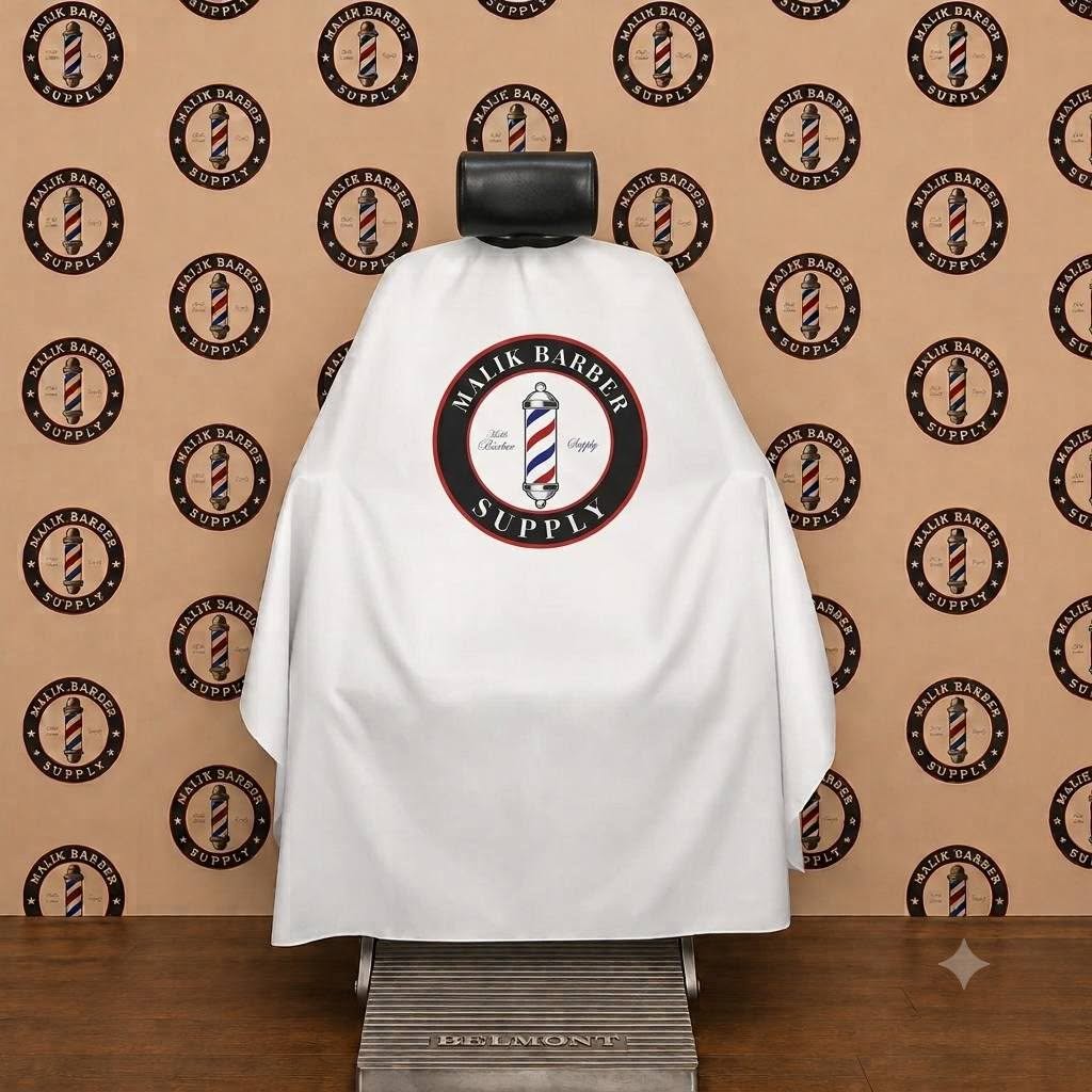 Premium Barber Cape – Custom Logo Hair Cutting Cape | Malik Barber Supply Professional barber cape with a custom logo printing area displayed on a barber chair.