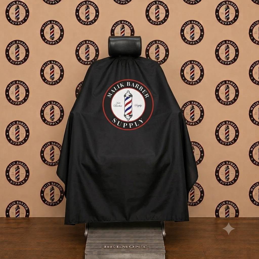 Premium Barber Cape – Custom Logo Hair Cutting Cape | Malik Barber Supply Professional barber cape with a custom logo printing area displayed on a barber chair.