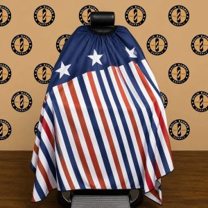 Professional barber cape with a custom logo printing area displayed on a barber chair.
