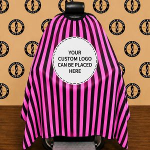 Professional barber cape with a custom logo printing area displayed on a barber chair.